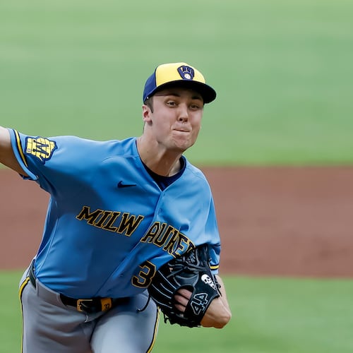 Milwaukee Brewers pitcher Jacob Misiorowski, right, delivers a pitch to Atlanta Braves' Matt Olson during the first inning of a baseball game, Friday, June 19, 2026, in Atlanta. (AP Photo/Erik S. Lesser)