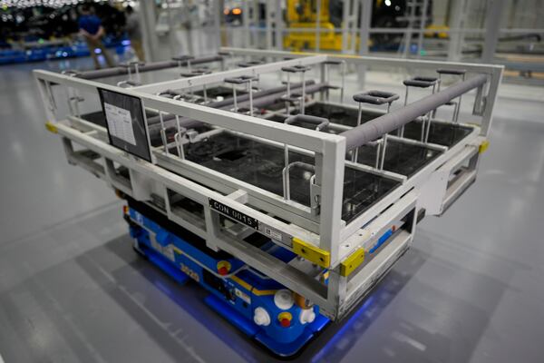 A robotic lift moves during a media tour at the Hyundai Motor Group Metaplant America, Wednesday, March 26, 2025, in Ellabell, Ga. (AP Photo/Mike Stewart)