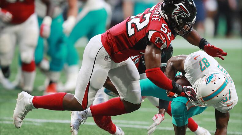 Falcons linebacker Emmanuel Ellerbee levels Miami Dolphins wide receiver Rashawn Scott during the first quarter in a NFL preseason game on Thursday, August 30, 2018, in Atlanta.  Curtis Compton/ccompton@ajc.com