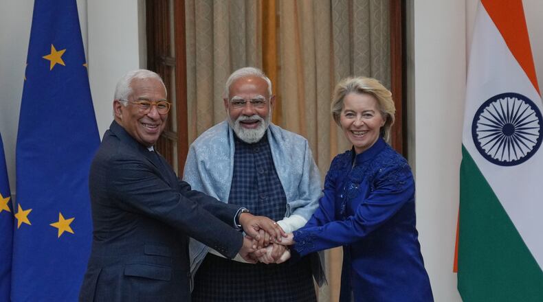 Indian Prime Minister Narendra Modi, center, welcomes European Council President Antonio Costa, left and European Commission President Ursula von der Leyen before their meeting in New Delhi, India, Tuesday, Jan. 27,2026. (AP Photo/Manish Swarup)