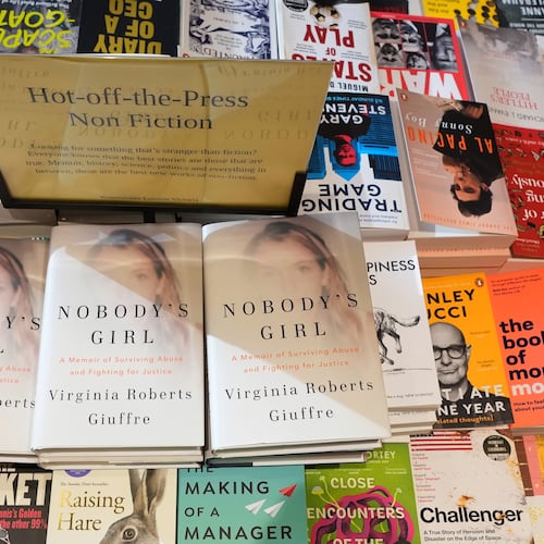 The memoir book of Virginia Giuffre, "Nobody's Girl" is seen amongst other books in a store and is up for sale in London, Tuesday, Oct. 21, 2025 six months after Giuffre died by suicide in April.(AP Photo/Kirsty Wigglesworth)