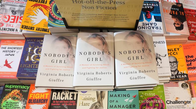 The memoir book of Virginia Giuffre, "Nobody's Girl" is seen amongst other books in a store and is up for sale in London, Tuesday, Oct. 21, 2025 six months after Giuffre died by suicide in April.(AP Photo/Kirsty Wigglesworth)