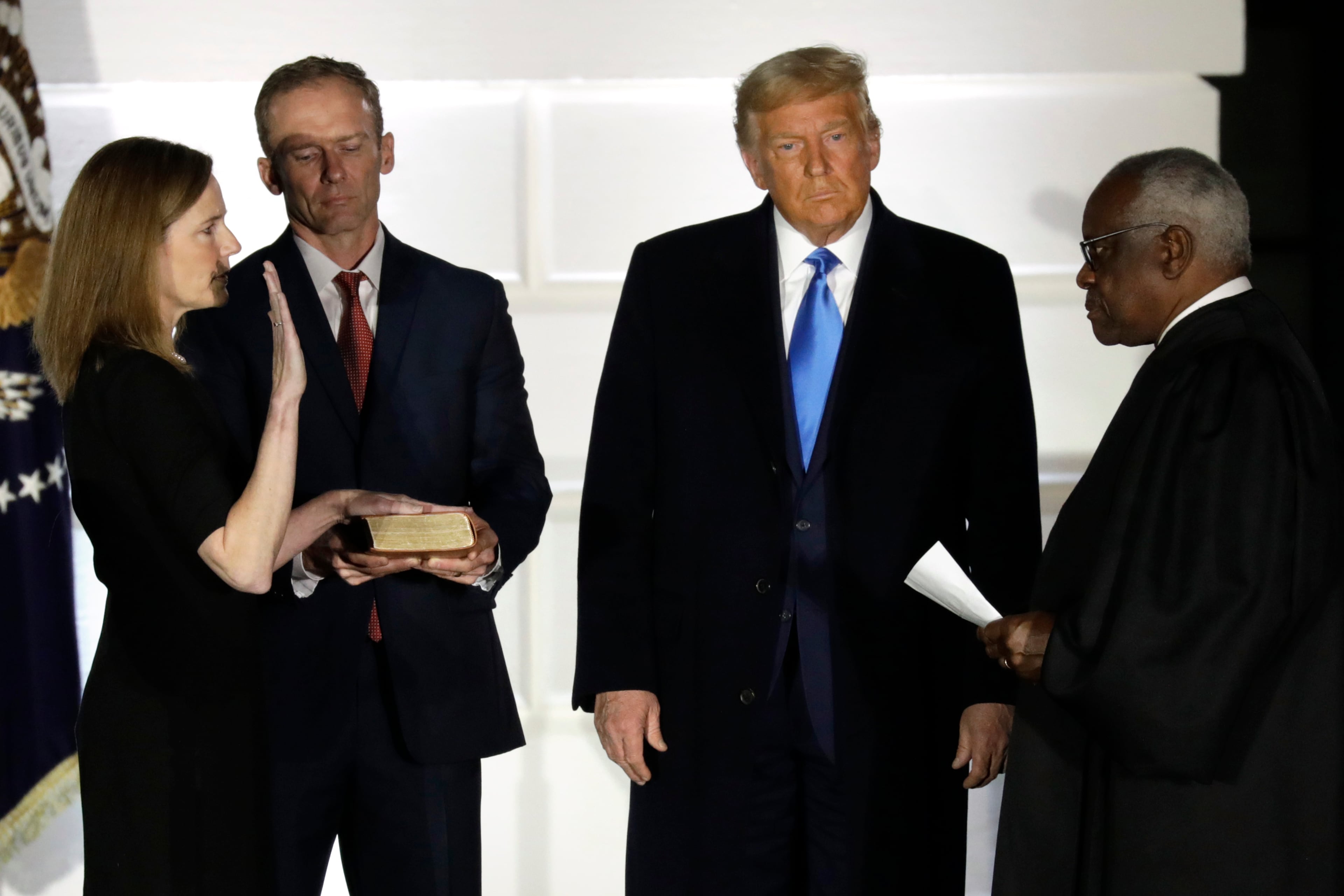 Amy Coney Barrett is sworn in as a Supreme Court associate justice in 2020. Although fellow justices, like Clarence Thomas (right), say the high court should revisit its same-sex marriage ruling, Barrett says Obergefell had “concrete reliance interests,” something justices weigh when determining whether to overturn a decision. (Yuri Gripas/Abaca Press/TNS)