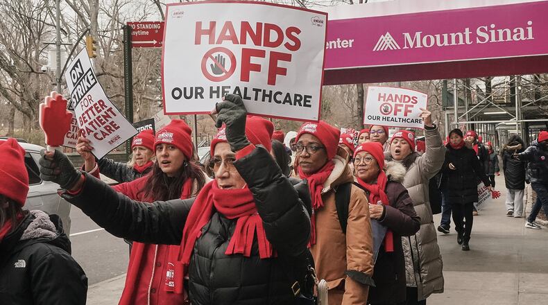Striking nurses demonstrate outside Mt. Sinai Hospital, in New York, Wednesday, Jan. 14, 2026. (AP Photo/Richard Drew)