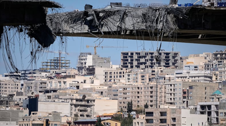 A bridge struck by U.S. airstrikes on Thursday is seen in the town of Karaj, west of Tehran, Iran, Friday, April 3, 2026. (AP Photo/Vahid Salemi)