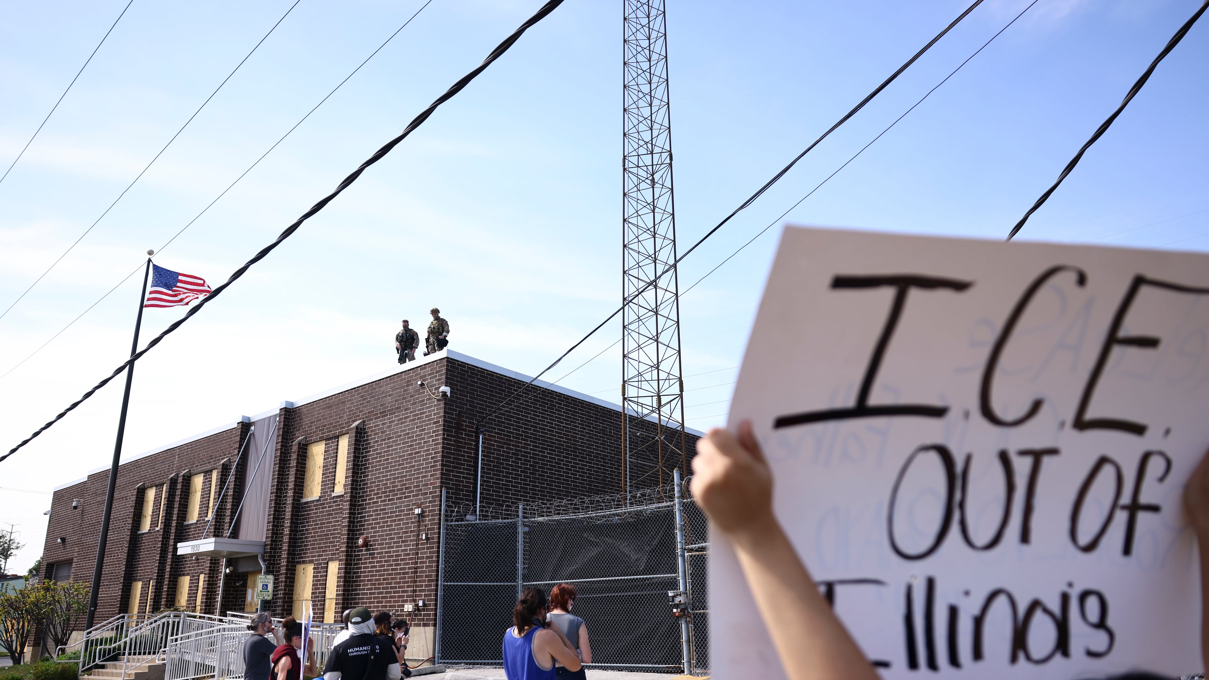 Immigration and Customs Enforcement facility officers stand guard outside an ICE facility in Broadview, Friday, Sept. 19, 2025. (Anthony Vazquez/Chicago Sun-Times via AP)