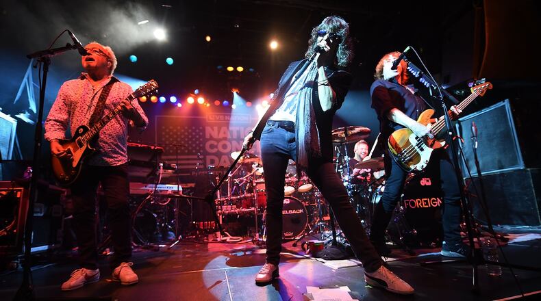 (L-R) Musicians Mick Jones, Kelly Hansen and Jeff Pilson of Foreigner perform during Live Nation’s celebration of The 3rd Annual National Concert Day at Irving Plaza earlier this year in New York City. (Photo by Michael Loccisano/Getty Images for Live Nation)