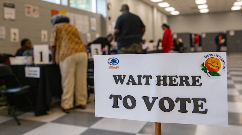 Voters check in to cast their ballots on the last day of early voting on Friday, Nov. 1, 2024 at C.T. Martin Natatorium and Recreation Center in South Fulton County. (Jenni Girtman for the AJC/2024)