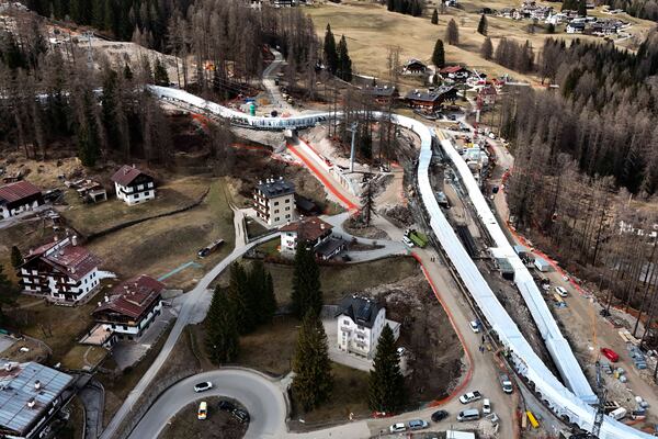 Construction work takes place at the Cortina Sliding Center, venue for the bob, luge and skeleton disciplines at the Milan Cortina 2026 Winter Olympics, in Cortina D'Ampezzo, Italy, Tuesday, March 25, 2025. (AP Photo/Luca Bruno)