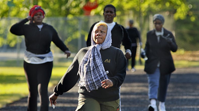 Resist the temptation to bundle up like Nanook of the North. Exercise generates heat, and if you start to sweat, you'll get cold when that sweat dries. Instead, dress in layers. Start with a thin synthetic layer to wick sweat. Avoid cotton. Pull on a wool or fleece layer next, and top it off with a waterproof, breathable outer layer. If it's really cold, you might want a face mask or scarf to warm air before you breathe it in.