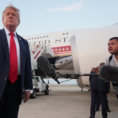 President Donald Trump speaks to reporters as he exits Air Force One at Joint Base Andrews, Md., after attending the World Cup final soccer match, Sunday, July 19, 2026. (AP Photo/Jacquelyn Martin)