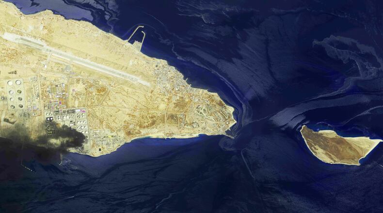 This image from an Airbus Defence and Space's Pléiades Neo satellite shows a fire at an oil refinery on Iran’s Lavan Island, left, and an oil slick in the waters of the Persian Gulf around Shidvar Island, right, April 10, 2026. (Airbus Defence and Space© via AP)