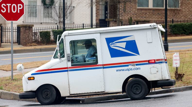 A surge of last-minute absentee ballots requested Oct. 25 will be shipped via U.S. Postal Service Express Mail or UPS Overnight to be delivered by Friday — the last day of early voting. (Jason Getz/The Atlanta Journal-Constitution/TNS)