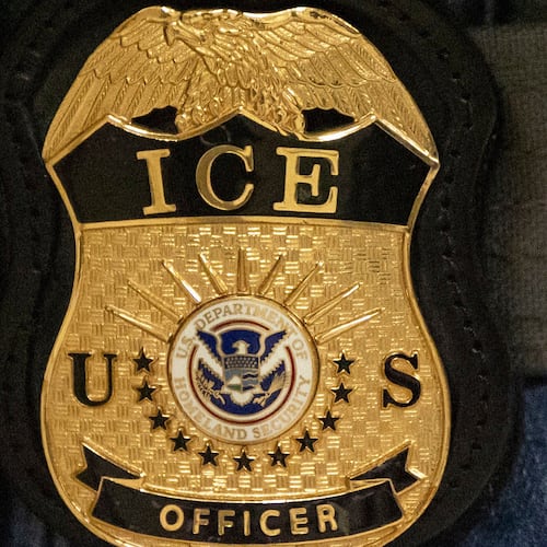 FILE - A federal agent wears an Immigration and Customs Enforcement badge in New York, June 10, 2025. (AP Photo/Yuki Iwamura, File)