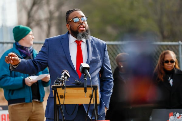 "For too long, policymakers have ignored the root causes of what is ailing the individuals incarcerated in this building," says Devin Franklin, senior movement policy counsel at the Southern Center for Human Rights, addressing the media during a news conference at the Fulton jail. (Miguel Martinez/AJC)