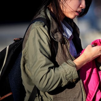 A student uses her cellphone at the Bronx High School of Science in New York, Jan. 11, 2016. (Yana Paskova/The New York Times)