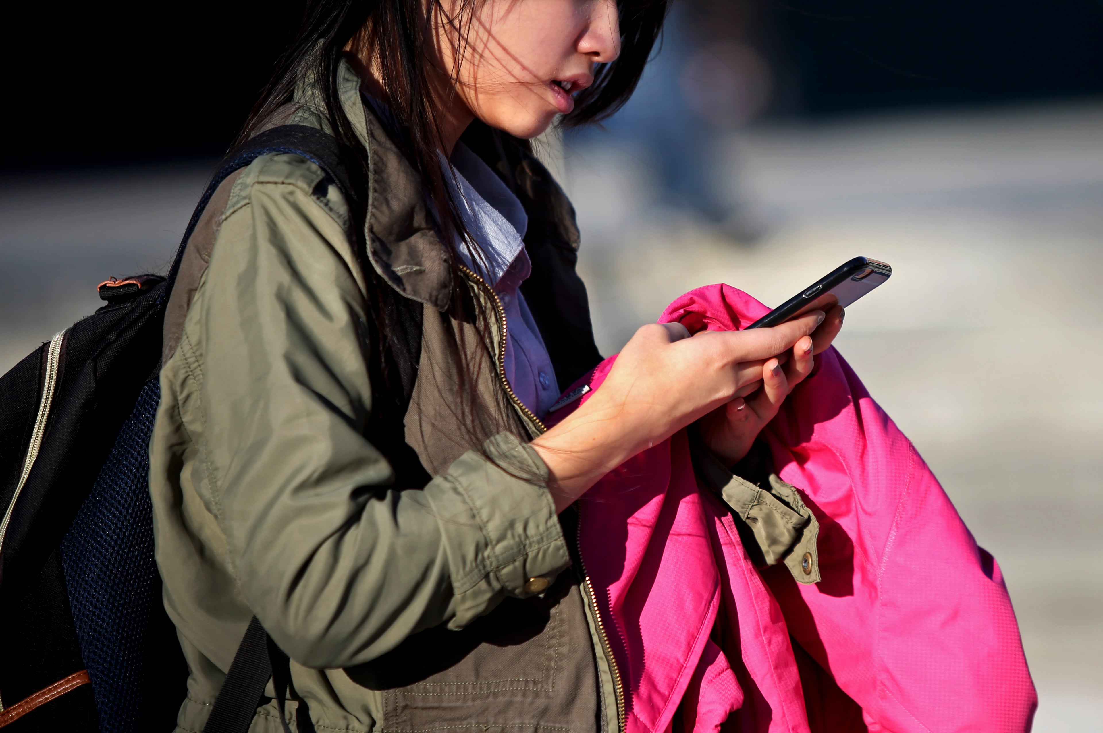 A student use her cell phone at the Bronx High School of Science in New York, Jan. 11, 2016. (Yana Paskova/The New York Times)