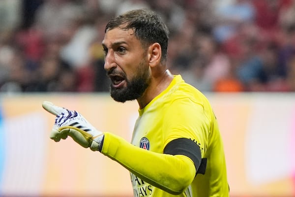 Paris Saint-Germain's goalkeeper Gianluigi Donnarumma argues to officials after the Club World Cup quarterfinal soccer match between PSG and Bayern Munich in Atlanta, Saturday, July 5, 2025. (AP Photo/Mike Stewart)