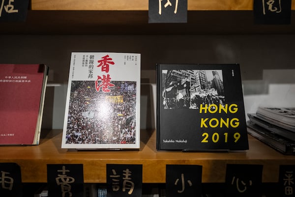 Books about Hong Kong politics are displayed on bookshelf at Leticia Wong's bookstore in Hong Kong, Friday, June 20, 2025. (AP Photo/Chan Long Hei)