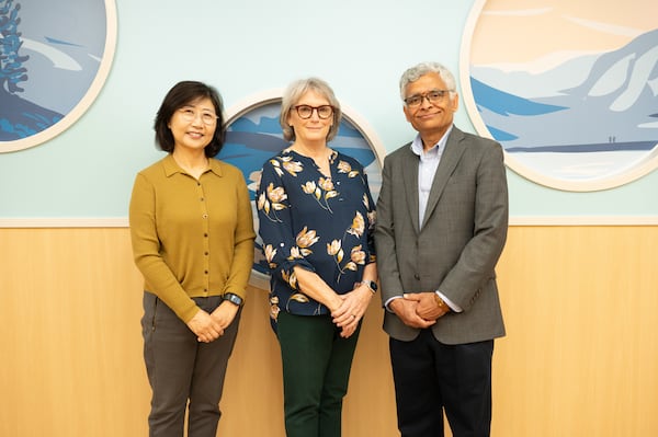 Sungmee Park (left), a principal research scientist, joins Dr. Jana Stockwell, a pediatric critical care physician at Children’s Healthcare of Atlanta, and Sundaresan Jayaraman, a Georgia Tech professor and lead researcher, for a photo. (Courtesy of Georgia Tech) 