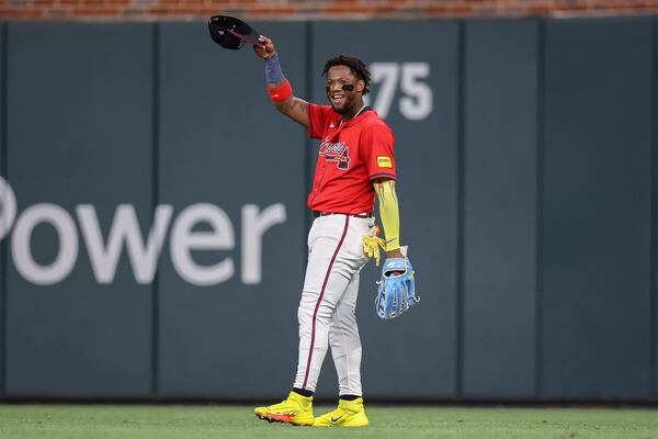 Atlanta Braves outfielder Ronald Acuna Jr. reacts after making an outfield assist in the eighth inning of a baseball game against the San Diego Padres, Friday, May 23, 2025, in Atlanta. (AP Photo/Colin Hubbard)
