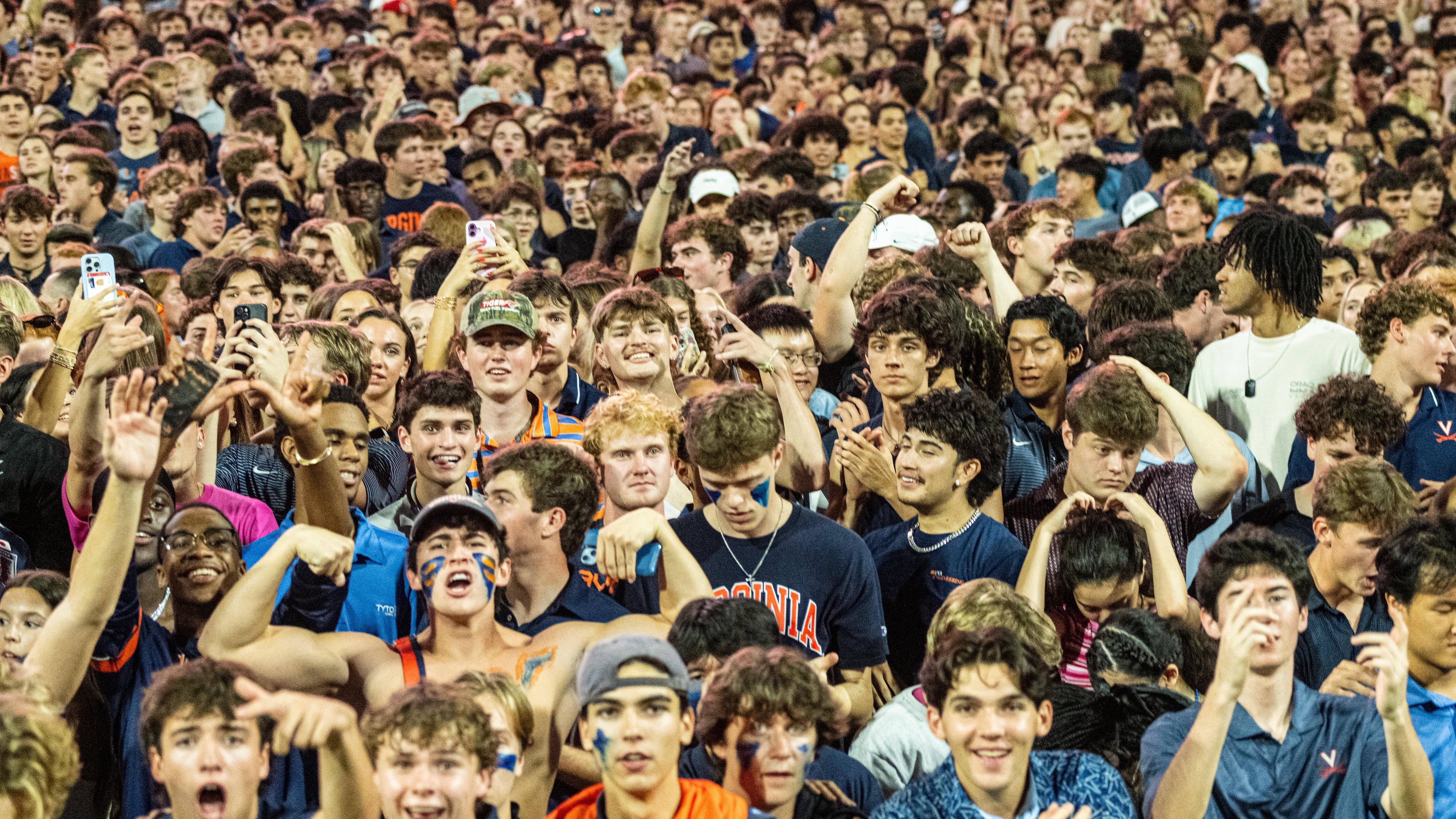 Virginia Fans take the field after overtime win over Florida State of an NCAA college football game, Friday, Sept. 26 2025, in Charlottesville, Va. (AP Photo/Robert Simmons)