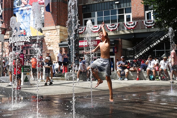 Kiddos enjoy the fountains outside Truist Park prior to Tuesday's MLB All-Star Game. (Abbey Cutrer/AJC)