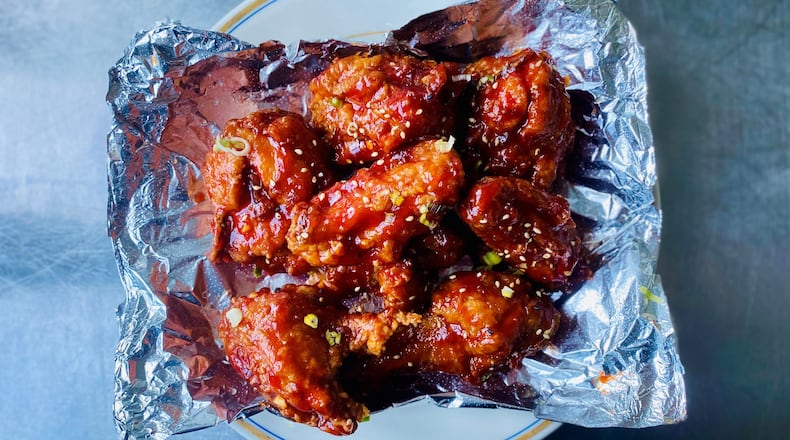 Yakitori Jinbei’s Korean fried chicken, glazed with a sweet chili sauce, travels quite well as takeout. Wendell Brock/For The AJC