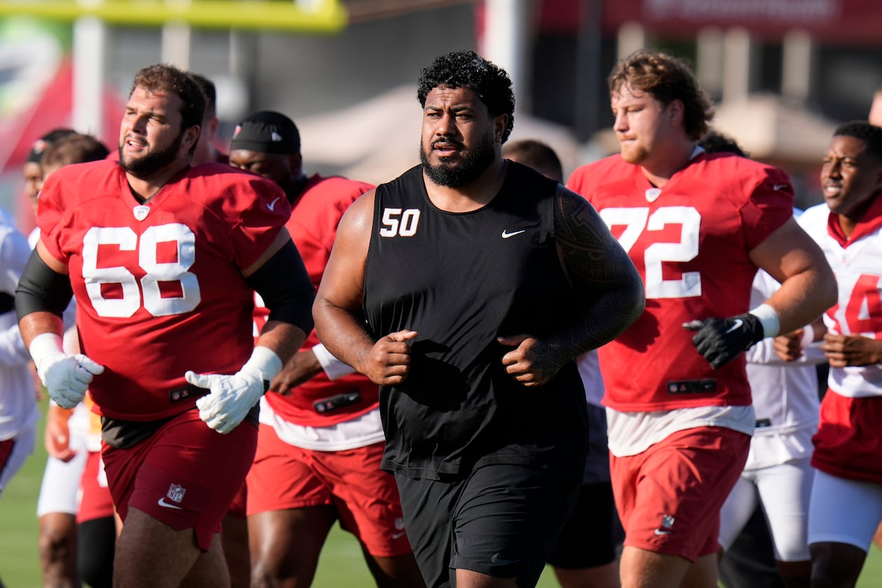 Tampa Bay Buccaneers guard Ben Bredeson (from left), defensive tackle Vita Vea (50) and offensive tackle Luke Haggard (72) run during Back Together Weekend. The enormous Vea often requires a double-team block on most plays. (Chris O'Meara/AP)