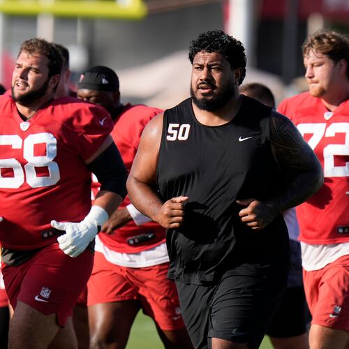 Tampa Bay Buccaneers guard Ben Bredeson (from left), defensive tackle Vita Vea (50) and offensive tackle Luke Haggard (72) run during Back Together Weekend. The enormous Vea often requires a double-team block on most plays. (Chris O'Meara/AP)