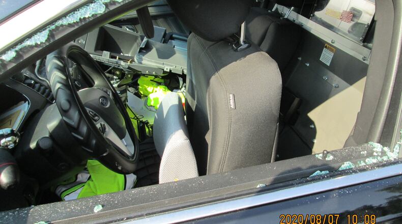 Marietta police have arrested a man accused of breaking into six vehicles, including four Cobb County police patrol cars.