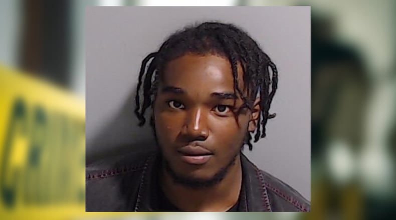 Jaryn Ware is charged with murder and three counts of aggravated assault in the killing of 48-year-old Cheron Wade, according to authorities.