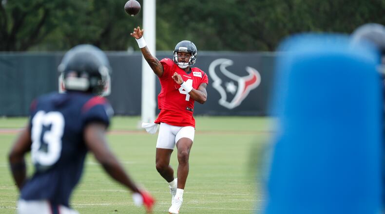 Houston Texans quarterback Deshaun Watson (4) throws a pass to wide receiver Brandin Cooks (13) during training camp Monday, Aug. 24, 2020, in Houston. (Brett Coomer/Houston Chronicle)