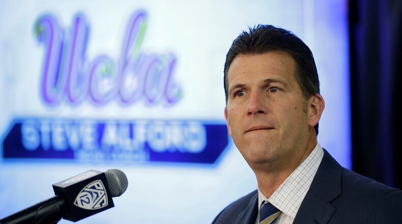 UCLA head coach Steve Alford listens to questions during the Pac-12's NCAA college basketball media day.