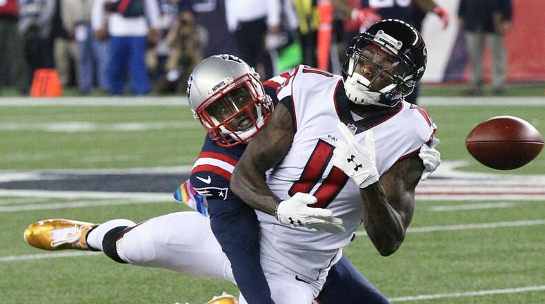 October 22, 2017 Foxborough: Patriots defensive back Duron Harmon breaks up a pass to Falcons Julio Jones during the first half in a NFL football game on Sunday, October 22, 2017, in Foxborough.   Curtis Compton/ccompton@ajc.com