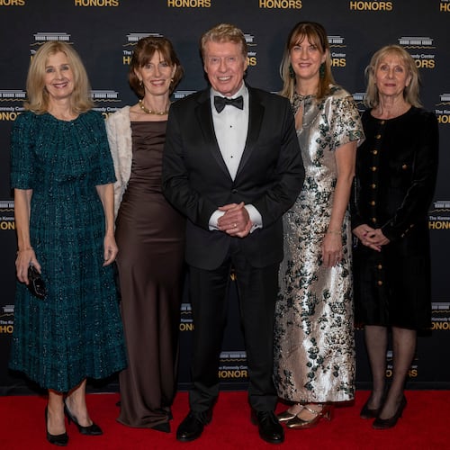 2025 Kennedy Center Honoree Michael Crawford, center, and his family arrive on the red carpet for the 48th Kennedy Center Honors Medallion Reception, hosted at the U.S. Department of State, Saturday, Dec. 6, 2025 in Washington. (AP Photo/Kevin Wolf)