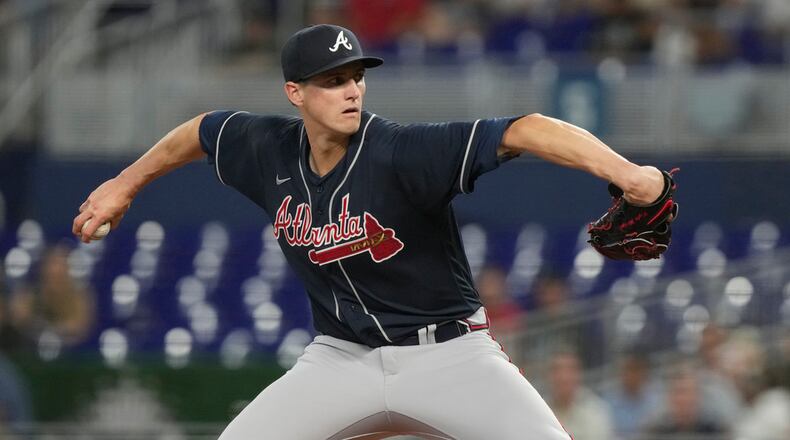Atlanta Braves starting pitcher Kyle Wright (30) aims a pitch during the third inning of a baseball game against the Miami Marlins, Wednesday, May 3, 2023, in Miami. (AP Photo/Marta Lavandier)