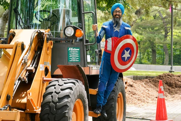 Vishavjit Singh, who educates youth about Sikhism through his Captain Sikh America character, poses for a portrait in costume in Riverbank State Park, in New York's Harlem neighborhood, Friday, May 30, 2025. (AP Photo/Richard Drew)
