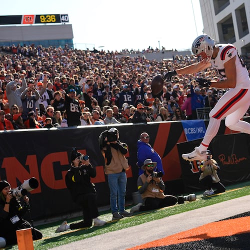 New England Patriots tight end Hunter Henry (85) celebrates after catching a touchdown pass during the first half of an NFL football game against the Cincinnati Bengals, Sunday, Nov. 23, 2025, in Cincinnati. (AP Photo/Carolyn Kaster)