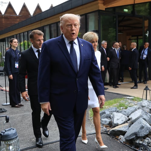 U.S. President Donald Trump walks after posing for a family photo photograph during a gala dinner as part of the G7 summit, in Evian-les-Bains, France, Tuesday June 16, 2026. (Ludovic Marin/Pool Photo via AP)