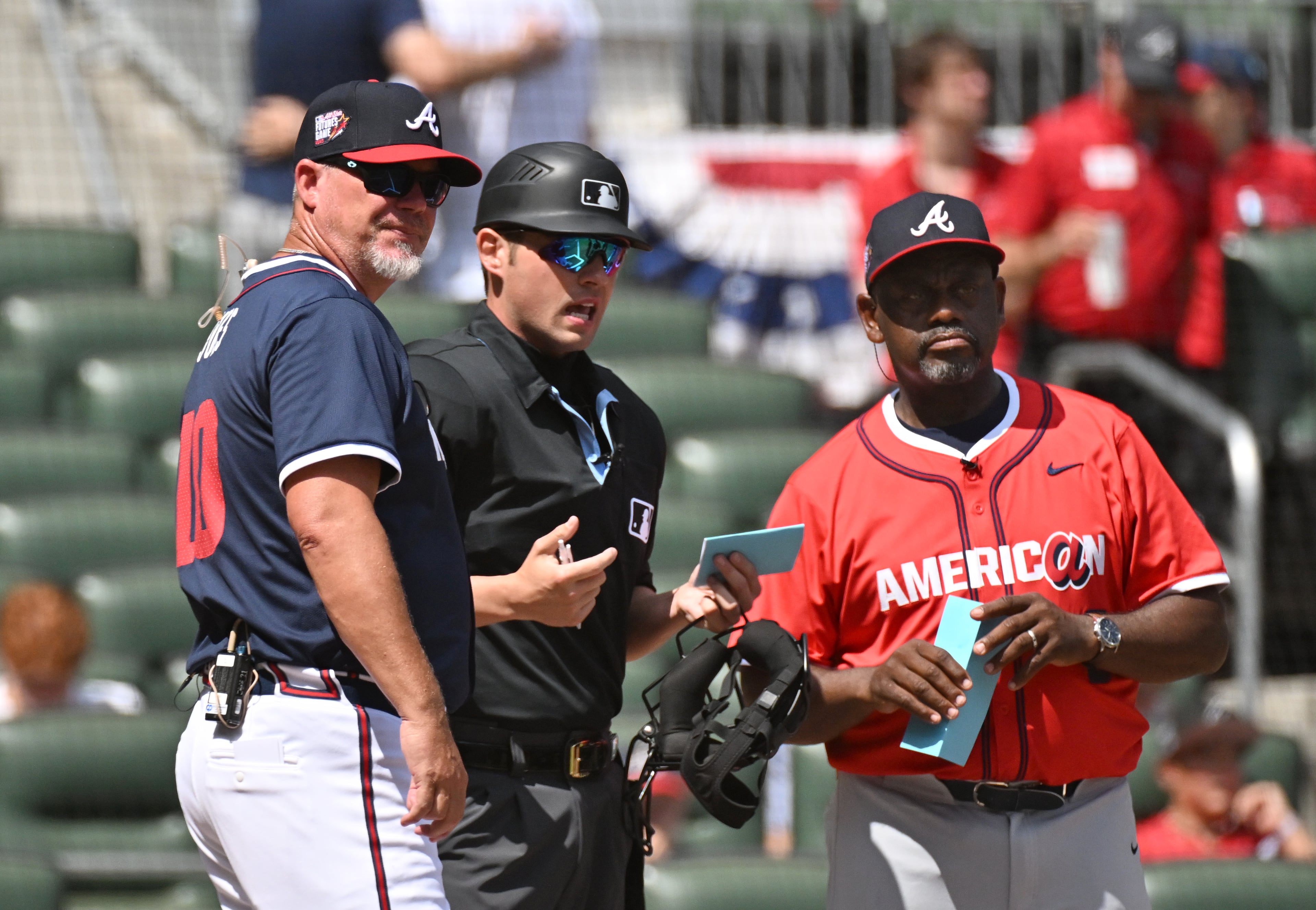 National League manager Chipper Jones (left) and American League manager Marquis Grissom greet before the All-Star Futures Game at Truist Park, Saturday, July 12, 2025, in Atlanta. National League won 4-2 over American League. (Hyosub Shin / AJC)