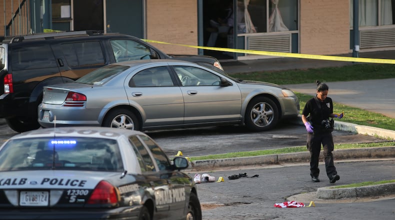DeKalb County police investigate after a fatal shooting outside a motel on Wednesday, June 3, 2015. (BEN GRAY / BGRAY@AJC.COM)