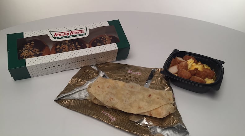Krispy Kreme Reese's peanut butter doughnuts and Chick-Fil-A Hash Brown Scramble burrito and bowl. / Photo by Erica Hernandez