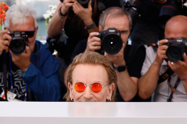 Bono poses for photographers at the photo call for the film 'Bono: Stories of Surrender' at the 78th international film festival, Cannes, southern France, Saturday, May 17, 2025. (Photo by Joel C Ryan/Invision/AP)