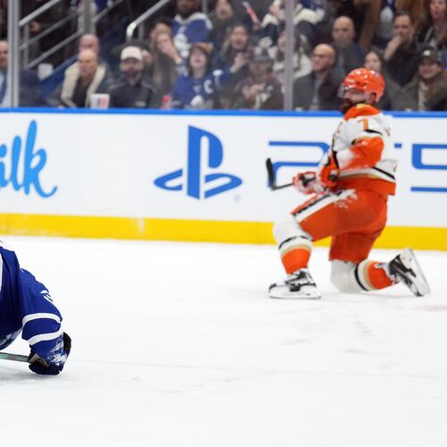 Toronto Maple Leafs Auston Matthews, left, is injured by Anaheim Ducks Radko Gudas during the second period of an NHL hockey game in Toronto, Thursday, March 12, 2026. (Nathan Denette/The Canadian Press via AP)