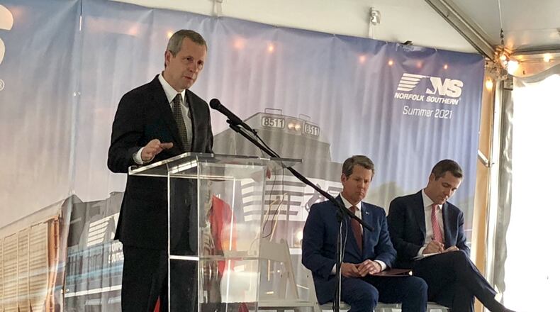 Norfolk Southern Chairman and CEO Jim Squires, left, speaks Tuesday, March 26, 2019, during a groundbreaking ceremony for the company’s new Midtown Atlanta headquarters.