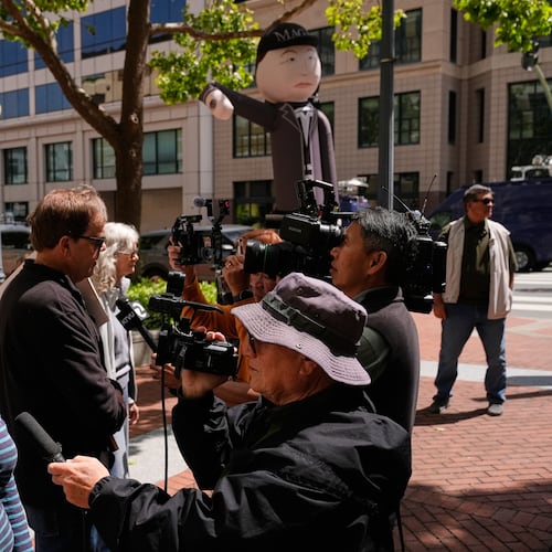 Protesters are interviewed by media outside the U.S. District Court, in Oakland, Calif., Monday, April 27, 2026. (AP Photo/Godofredo A. Vásquez)