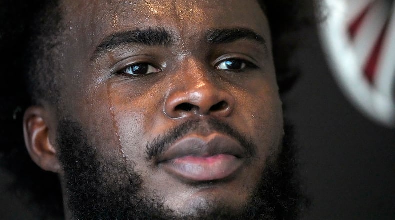 Atlanta Falcons defensive end Grady Jarrett speaks to reporters after the team's NFL football training camp practice Thursday, July 27, 2023, in Flowery Branch, Ga. (AP Photo/John Bazemore)