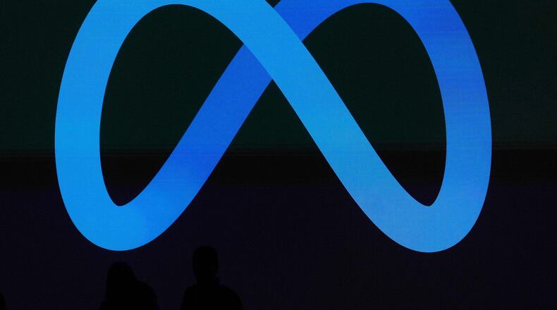 FILE - A Meta logo is shown on a video screen at LlamaCon 2025, an AI developer conference, in Menlo Park, Calif., April 29, 2025. (AP Photo/Jeff Chiu, File)