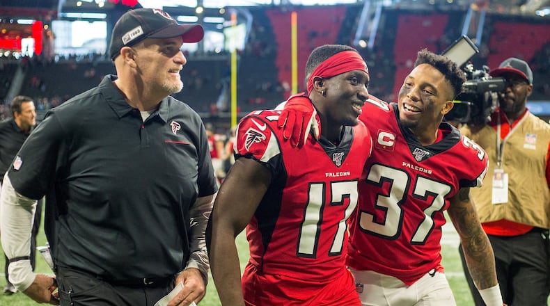 12/08/2019 -- Atlanta, Georgia -- Atlanta Falcons head coach Dan Quinn (left) walks off the field with Atlanta Falcons wide receiver Olamide Zaccheaus (17) and Atlanta Falcons free safety Ricardo Allen (37) after defeating the Carolina Panthers during a NFL football game at Mercedes-Benz Stadium in Atlanta, Sunday, December 8, 2019. Atlanta Falcons rookie wide receiver Olamide Zaccheaus (17) scored a touchdown when he caught a 93-yard touchdown pass from Atlanta Falcons quarterback Matt Ryan. (ALYSSA POINTER/ALYSSA.POINTER@AJC.COM)
